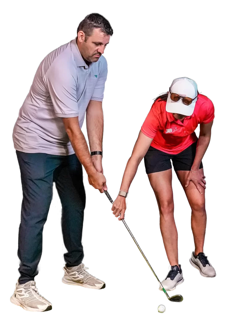 A man receiving golf lessons at Hukd golf Manchester